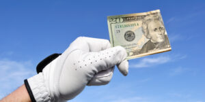 Golf glove and dollar bill